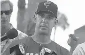  ?? CARLINE JEAN/SUN SENTINEL ?? Jorge Posada speaks to reporters during Marlins spring training at Roger Dean Chevrolet Stadium in Jupiter.