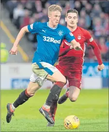  ??  ?? Rangers’ Ross Mccrorie takes the ball past Aberdeen’s Kenny Mclean the last time Rangers visited Pittodrie