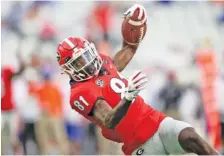  ?? PHOTO BY MATT STAMEY ?? Georgia wide receiver Marcus Rosemy-Jacksaint scores a touchdown during Saturday’s loss to Florida.