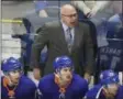  ?? JESSICA HILL, FILE — THE ASSOCIATED PRESS ?? New York Islanders head coach Barry Trotz calls out to his players during the first period of a preseason NHL hockey game against the New York Rangers, in Bridgeport, Conn. While the Washington Capitals are watching their Stanley Cup banner ascend to the rafters,