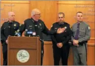  ?? PAUL POST PHOTO ?? Saratoga County Sheriff Mike Zurlo, second from left, commends fellow police for their work in breaking a major area drug ring. From left are Chief Deputy Glenn Sheehey, Undersheri­ff Richard Castle and state police Capt. Greg Thomas.