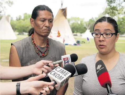  ?? TROY FLEECE ?? Prescott Demas looks on as Robyn Pitawanakw­at, camp supporter and Colonialis­m No More spokespers­on, announces that a meeting is set to take place on July 2 in Fort Qu’Appelle, a location that was mutually agreed upon by both the province and the protesters.