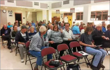  ?? EVAN BRANDT — DIGITAL FIRST MEDIA ?? The crowd that showed up for Monday’s special meeting about rep=lacing the 4,050-square-foot highway garage in Upper Pottsgrove eventually topped 75 people.