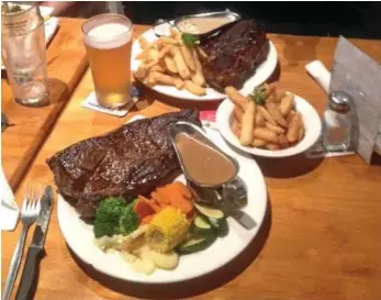  ?? PHOTOS: CONTRIBUTE/NEV MADSEN ?? NUMBER ONE: The Meringanda­n Hotel is famous with Darling Downs residents for its one kilogram steak.