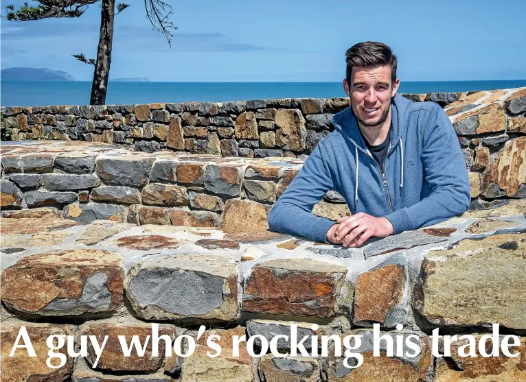  ??  ?? Nicolas Piveteau with a huge stone wall he and his team have been building at Raumati Beach, but he’s just as happy restoring old buildings or building new pizza ovens. Photos: JOHN NICHOLSON/STUFF