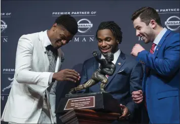  ?? CRAIG RUTTLE - ASSOCIATED PRESS ?? Oklahoma’s Baker Mayfield, far right, won the Heisman ahead of Lamar Jackson, left, and Bryce Love of Stanford.