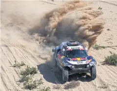  ?? AFP ?? Mini driver Carlos Sainz and co-driver Lucas Cruz compete in the first stage of the 2021 Dakar Rally in Saudi Arabia.