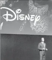  ?? Chris Pizzello Chris Pizzello/Invision/Associated Press ?? DAVE HOLLIS, Disney’s studio distributi­on chief, said at CinemaCon that the firm’s “commitment to the theatrical window has never, ever been stronger.”