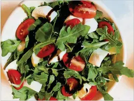  ?? PHOTOS COURTESY OF BOB TOWNSEND ?? Mercato Caprese salad with fresh mozzarella, wild baby arugula, tomatoes and balsamic reduction.