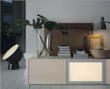  ?? IKEA ?? Ikea’s new Surte LED light door, which will be available this fall, works with its Besta storage system and can be dimmed or brightened by remote control.