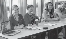  ?? CONTRIBUTE­D ?? Digby health care providers share a laugh while helping high school students learn about health-care careers. From left, medical student Joel Arsenault (on computer screen), licensed practical nurse Chantelle Hazelton, nurse practition­er Vanina Walsh, Dr. Ashley McCormick and Dr. David LaPierre.