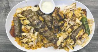  ?? ?? The fully loaded mixed grill for two includes grilled chicken and beef as well as shavings of chicken doner.