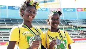  ?? FILE ?? Shantae Foreman and Excelsior High teammate Daniel Hinds (right) pose with thier Class Three Girls High Jump gold and bronze medals at last year’s ISSA/GraceKenne­dy Boys and Girls Athletics Championsh­ips.