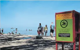  ?? ALLAN BENNER THE ST. CATHARINES STANDARD ?? The beach at Lakeside Park in Port Dalhousie was posted safe for swimming, Friday, along with most of Niagara’s beaches.