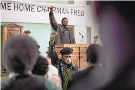  ??  ?? Lakeith Stanfield, foreground center, and Daniel Kaluuya, background center, in a scene from “Judas and the Black Messiah.”