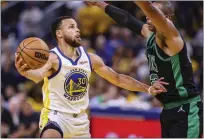  ?? SCOTT STRAZZANTE — SAN FRANCISCO CHRONICLE VIA AP ?? The Warriors' Stephen Curry goes up against the Celtics' Al Horford in Game 5 of the NBA Finals on Monday.