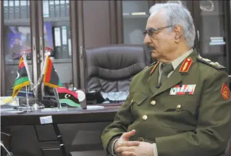  ?? Mohammed El-Sheikhy / Associated Press 2015 ?? Gen. Khalifa Hifter, whose forces recently captured key oil facilities, listens during an interview in 2015. He says Libya would be best served with a leader with military experience.