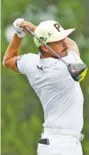  ?? AP PHOTO/MARK HUMPHREY ?? Rickie Fowler watches his tee shot on the 17th hole during the first round of the FedEx St. Jude Invitation­al on Thursday at TPC Southwind in Memphis.