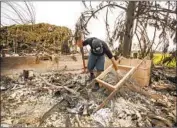  ??  ?? FRED SKAFF looks for a wedding ring in the rubble of his Phoenix home, where he lived for 22 years.