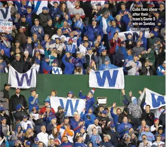  ?? NAM Y. HUH/ AP ?? Cubs fans cheer after their team’s Game 5 win on Sunday.