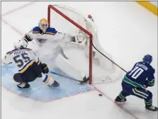  ?? Jason Franson/The Canadian Press via AP ?? Vancouver Canucks’ Tanner Pearson (70) is stopped by St. Louis Blues goalie Jake Allen (34) as Colton Parayko (55) defends during the second period of an NHL Western Conference Stanley Cup playoff series, in Edmonton, Alberta, on Aug. 21.