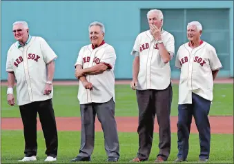  ?? CHARLES KRUPA/AP PHOTO ?? Players from the 1967 “Impossible Dream” Boston Red Sox team watch a ceremony prior to the Red Sox game Wednesday against the St. Louis Cardinals in Boston. From left are Ken Harrelson, Rico Petrocelli, Jim Lonborg and Carl Yastrzemsk­i.