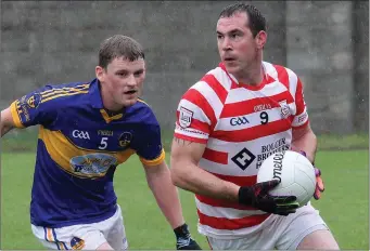  ??  ?? John Breen of Ferns St. Aidan’s is closed down by Rosslare’s match-winner Niall Walsh.