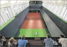  ??  ?? Sport of kings: Nick Howell and Ben Taylor-Matthews play a medieval form of tennis in the Real Tennis Champions Trophy in London. Photo: Daniel Leal-Olivas/AFP