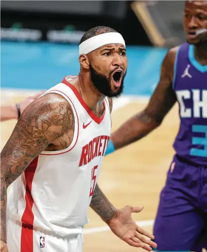 ?? Nell Redmond / Associated Press ?? Center DeMarcus Cousins expresses his dismay with a call in Monday night’s loss to the Hornets that came with the Rockets resting John Wall and Eric Gordon to start a set of back-to-back games and with Christian Wood injured.