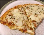  ?? PETER HUOPPI/THE DAY ?? California Pizza Kitchen Artisanal Style Cheese frozen pizza with cauliflowe­r crust