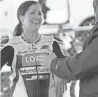  ?? MARK HOFFMAN ?? Motorcycle racer Caroline Olsen jokes around in the paddock before qualifying.