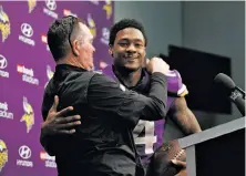  ?? Jeff Roberson / Associated Press ?? Head coach Mike Zimmer greets Diggs at a news conference after Minnesota advanced to the NFC Championsh­ip Game.