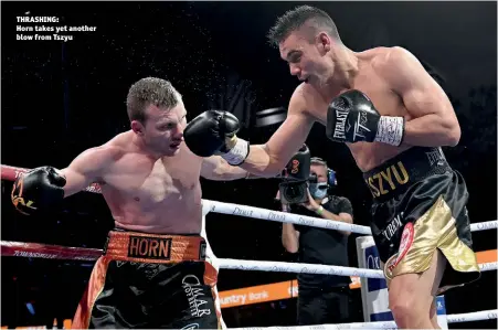  ?? Photo: BRADLEY KANARIS/GETTY IMAGES ?? THRASHING: Horn takes yet another blow from Tszyu