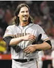  ?? Chris Carlson / Associated Press ?? Giants starter Jeff Samardzija celebrates after getting out of the fifth inning.