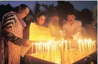  ??  ?? Activists of Pakistan’s civil society light candles to pay tribute to the victims of bombing, in Peshawar. Dozens were killed in the attack that struck the gathering of Pakistani lawyers at a hospital in of Quetta.