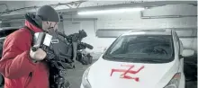  ?? THE CANADIAN PRESS FILES ?? A cameraman shoots a swastika painted on one of several cars on Feb. 24, 2015, in Montreal. Anti-Semitism is on the rise in the country, a Jewish advocacy group said Tuesday.