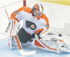  ??  ?? SUPER SAVE: Flyers goaltender Brian Elliott blocks a shot from the Penguins during the first period of the Game Two of their first-round play-off series.