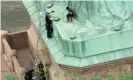  ??  ?? Okoumou, an activist, climbed the Statue of Liberty on 4 July. Photograph: AP