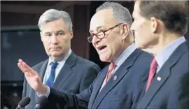  ?? Chip Somodevill­a Getty Images ?? SENATE DEMOCRATIC LEADER Charles E. Schumer, center, is calling on his caucus to force a filibuster to block the Supreme Court nomination.