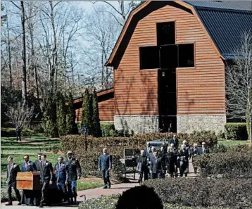  ?? CHUCK BURTON/AP ?? Pallbearer­s move the Rev. Billy Graham’s casket during a funeral service Friday at the library that bears his name.