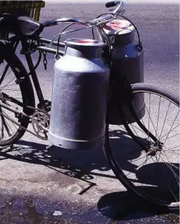  ??  ?? Milk delivery in buckets was the norm before aseptic packaging processes took hold in the industry.