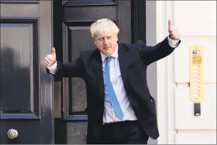  ?? Leon Neal / AFP/Getty Images ?? New Conservati­ve Party leader and incoming prime minister Boris Johnson arrives at the Conservati­ve party headquarte­rs in central London on Tuesday. Boris Johnson won the race to become Britain’s next prime minister on Tuesday, heading straight into a confrontat­ion over Brexit with Brussels and parliament, as well as a tense diplomatic standoff with Iran.