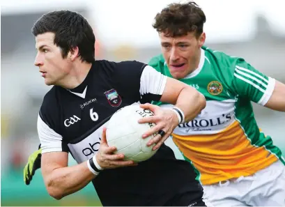  ??  ?? Brendan Egan of Sligo with Offaly’s Michael Brazil making a challenge.