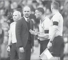  ?? — Reuters photo ?? File photo of Manchester City’s manager Pep Guardiola speaking to referee Andre Marriner.