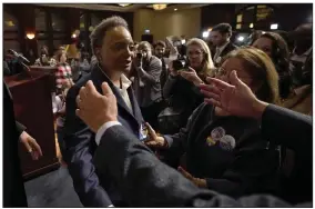  ?? (AP/Charles Rex Arbogast) ?? Chicago Mayor Lori Lightfoot (left) walks into the open arms of a supporter after conceding the mayoral election, late Tuesday in Chicago.