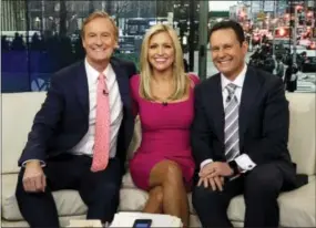  ?? RICHARD DREW — THE ASSOCIATED PRESS FILE ?? In this file photo, co-hosts Steve Doocy, from left, Ainsley Earhardt and Brian Kilmeade appear on the morning show “Fox & Friends” in New York. “Fox & Friends” has emerged as the morning television show of choice for President Donald Trump and his...