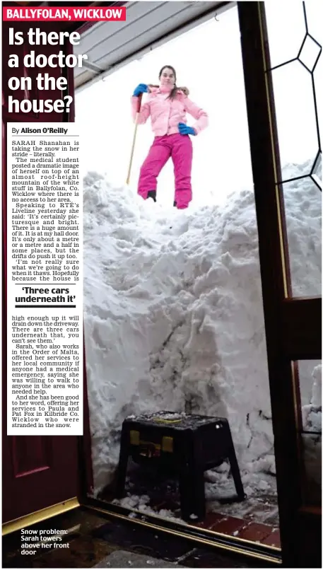  ??  ?? Snow problem: Sarah towers above her front door