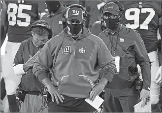  ?? SETH WENIG/AP PHOTO ?? New York Giants head coach Joe Judge, center, watches play from the sidelines during the fourth quarter of Monday’s game against the Pittsburgh Steelers in East Rutherford, N.J.