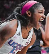  ?? JESSSICA HILL/AP PHOTO ?? UConn’s Crystal Dangerfiel­d celebrates during the No. 5 Huskies’ 109-74 victory over Temple on Saturday at Gampel Pavilion in Storrs.