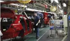  ?? ED REINKE/THE ASSOCIATED PRESS FILE PHOTO ?? Toyota’s Kentucky plant is where its flagship Camry sedans are produced.